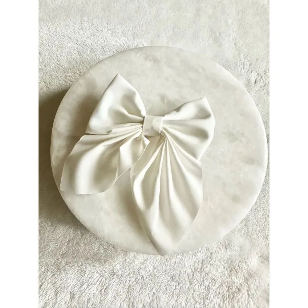 White satin hair bow with clip